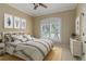 Stylishly decorated bedroom with a large window and plantation shutters at 8288 Lake James Dr, Lakeland, FL 33810