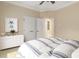 Bedroom features stylish decor, including marine-themed artwork and neutral tones at 8288 Lake James Dr, Lakeland, FL 33810