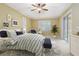 Bedroom with modern furnishings, a ceiling fan, and sliding glass door to the lanai at 8288 Lake James Dr, Lakeland, FL 33810