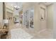 Inviting foyer with tile flooring, French doors, and elegant lighting, creating a grand entrance to the home at 8288 Lake James Dr, Lakeland, FL 33810