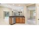 Open concept living space featuring a kitchen bar and a view of the lanai at 8288 Lake James Dr, Lakeland, FL 33810