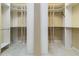 Spacious walk-in closet with custom shelving and ample storage space at 8288 Lake James Dr, Lakeland, FL 33810