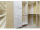 Organized walk-in closet featuring custom shelving, drawers, and hanging rods at 8288 Lake James Dr, Lakeland, FL 33810