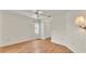 Spacious bedroom with wood floors, bright walls, and a ceiling fan for comfort at 5879 Swallow Dr, Lakeland, FL 33809