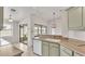 Bright kitchen with view of a screen porch, offering a seamless transition to outdoor entertaining at 5879 Swallow Dr, Lakeland, FL 33809