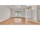 Spacious living area featuring sleek wood floors, and large windows for natural light at 5879 Swallow Dr, Lakeland, FL 33809