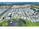 Aerial view showing home's location in a waterfront 55+ community at 6734 Kensington Ne Dr, Winter Haven, FL 33881