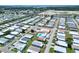 Aerial view of single-Gathering home in 55+ community near lake at 6734 Kensington Ne Dr, Winter Haven, FL 33881