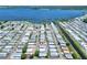 Aerial view highlighting a home's location in a lakefront community at 6734 Kensington Ne Dr, Winter Haven, FL 33881