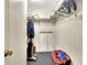Spacious closet with shelving and hanging rods at 6734 Kensington Ne Dr, Winter Haven, FL 33881