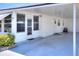 White mobile home with carport and walkway at 6734 Kensington Ne Dr, Winter Haven, FL 33881