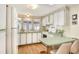Cozy kitchen with white appliances and light-colored cabinets at 6734 Kensington Ne Dr, Winter Haven, FL 33881