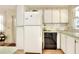 Functional kitchen with white appliances and ample counter space at 6734 Kensington Ne Dr, Winter Haven, FL 33881