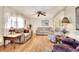 Living room with light wood floors and comfortable seating at 6734 Kensington Ne Dr, Winter Haven, FL 33881