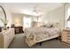 Spacious main bedroom with a comfortable bed and ample dresser space at 6734 Kensington Ne Dr, Winter Haven, FL 33881