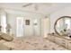 Comfortable main bedroom with ensuite bathroom access at 6734 Kensington Ne Dr, Winter Haven, FL 33881