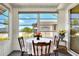 Dining area in sunroom with view of the outdoors at 6734 Kensington Ne Dr, Winter Haven, FL 33881
