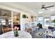 Sunroom with table, chairs and view into living room at 6734 Kensington Ne Dr, Winter Haven, FL 33881