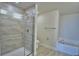 Updated bathroom featuring a glass-enclosed shower and separate soaking tub at 4676 Grandview Glen Dr, Auburndale, FL 33823