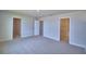 Bright bedroom boasts neutral colors, carpeted floors, and walk-in closet and bathroom entrances at 4676 Grandview Glen Dr, Auburndale, FL 33823