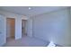 Spacious bedroom with a closet and doorway leading to the hallway, carpeted flooring at 4676 Grandview Glen Dr, Auburndale, FL 33823