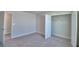 Bedroom features neutral carpet, a closet, and a window at 4676 Grandview Glen Dr, Auburndale, FL 33823