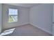 Cozy bedroom with plush carpet and a bright window allowing natural light at 4676 Grandview Glen Dr, Auburndale, FL 33823
