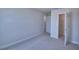Neutral bedroom featuring two doorways, with one leading to a walk-in closet at 4676 Grandview Glen Dr, Auburndale, FL 33823