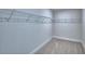 Walk-in closet features wire shelving and neutral carpeting at 4676 Grandview Glen Dr, Auburndale, FL 33823