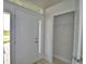 The bright foyer features a tiled floor, closet, and a white front door with glass panels at 4676 Grandview Glen Dr, Auburndale, FL 33823