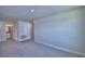 Hallway with neutral walls and carpeted floors leading to bedrooms and bathroom at 4676 Grandview Glen Dr, Auburndale, FL 33823