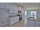This spacious kitchen features white cabinetry, stainless steel appliances, and granite countertops at 4676 Grandview Glen Dr, Auburndale, FL 33823