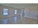 Bright and airy living room featuring tile floors and natural light from large windows at 4676 Grandview Glen Dr, Auburndale, FL 33823