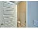 The powder room features a tiled floor and is freshly painted with neutral colors at 4676 Grandview Glen Dr, Auburndale, FL 33823