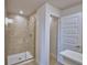 Bathroom featuring a tiled shower with glass door, and coordinated fixtures at 4687 Grandview Glen Dr, Auburndale, FL 33823