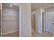 Walk-in closet with ventilated shelving for optimal storage and organization at 4687 Grandview Glen Dr, Auburndale, FL 33823