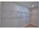 Large walk-in closet with neutral carpet, white trim and walls and wire shelving at 4687 Grandview Glen Dr, Auburndale, FL 33823