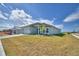 Exterior view of the home with a landscaped front yard and driveway at 4687 Grandview Glen Dr, Auburndale, FL 33823