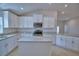 Spacious kitchen with granite countertops, stainless appliances and modern white cabinetry at 4687 Grandview Glen Dr, Auburndale, FL 33823
