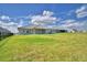 Lush backyard with a well manicured lawn and a panoramic view of neighborhood homes at 5280 Tennessee Ridge Ct, Auburndale, FL 33823