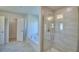 Modern bathroom featuring a glass shower, soaking tub and linen closet with tiled floors at 5280 Tennessee Ridge Ct, Auburndale, FL 33823
