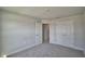 Bedroom with carpeted floors, neutral paint and a closet at 5280 Tennessee Ridge Ct, Auburndale, FL 33823