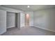 Bedroom with carpeted floors, neutral paint and a walk-in closet at 5280 Tennessee Ridge Ct, Auburndale, FL 33823