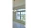 Bright dining area with large windows providing a picturesque view of the outdoors and neighborhood at 5280 Tennessee Ridge Ct, Auburndale, FL 33823
