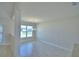 Bright dining room with tile floors, modern lighting, and a large window offering plenty of natural light at 5280 Tennessee Ridge Ct, Auburndale, FL 33823