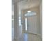 Welcoming entryway with tile flooring, a transom window, and a bright, airy feel at 5280 Tennessee Ridge Ct, Auburndale, FL 33823
