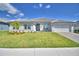 Beautiful single-Gathering home showcasing lush green lawn and an inviting exterior, perfect for Gathering living at 5280 Tennessee Ridge Ct, Auburndale, FL 33823
