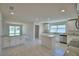 Bright, modern kitchen featuring stainless steel appliances, center island, and granite countertops at 5280 Tennessee Ridge Ct, Auburndale, FL 33823