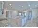 Modern kitchen with granite countertops, an island with a breakfast bar, and stainless steel appliances at 5280 Tennessee Ridge Ct, Auburndale, FL 33823