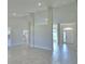 Bright and open living area with tile flooring, recessed lights and neutral wall colors, creating an inviting atmosphere at 5280 Tennessee Ridge Ct, Auburndale, FL 33823